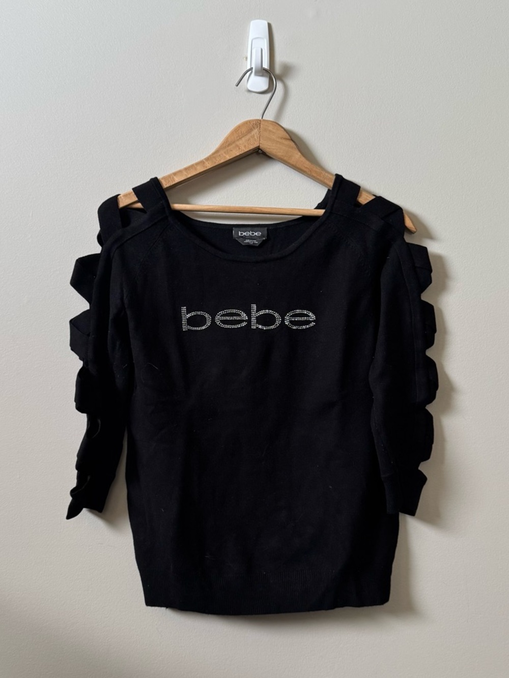 BEBE long sleeve black cut out sleeve studded logo sweater 💜